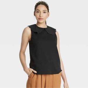 A new day black sleeveless tshirt